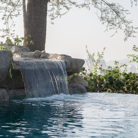 Relax in the pool with stunning views over Downtown