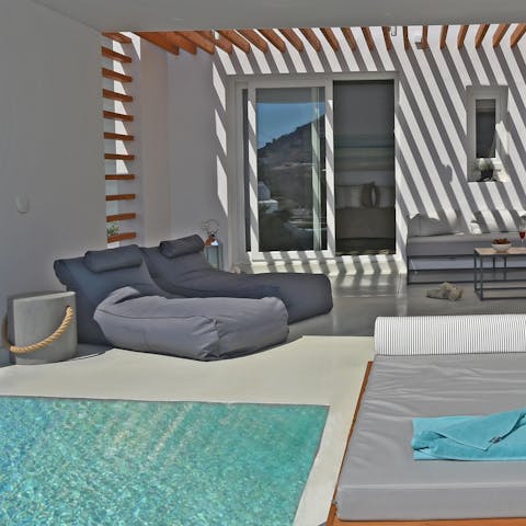 While away your days poolside on the comfy loungers