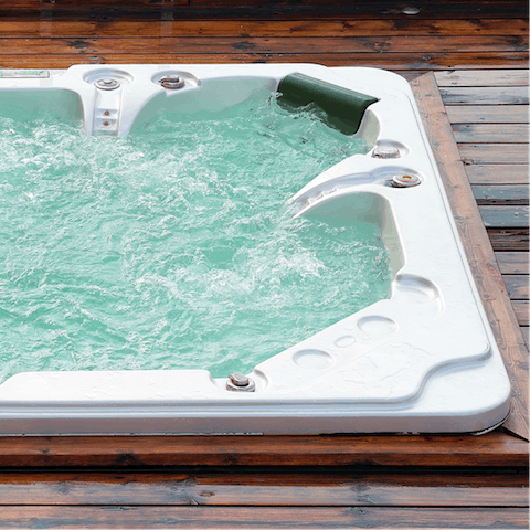 Sink into the whirlpool hot tub on the terrace with a drink in the evening to watch the sunset