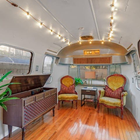 Enjoy a vintage hang-out area in the Airstream in the backyard