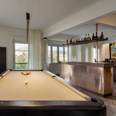Keep the night flowing with a game of pool beside the bar