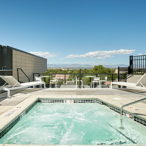 Enjoy a dip in the rooftop pool, admiring the mountain views while you splash in the water