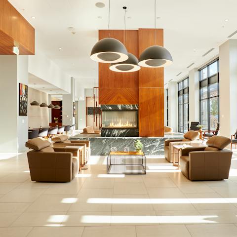 Admire the striking artwork and wood details in the lobby