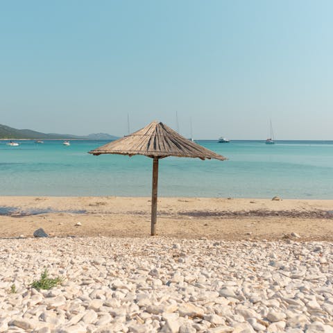 Grab your seaside essentials and saunter down to Plaka Beach, less than ten minutes from your villa