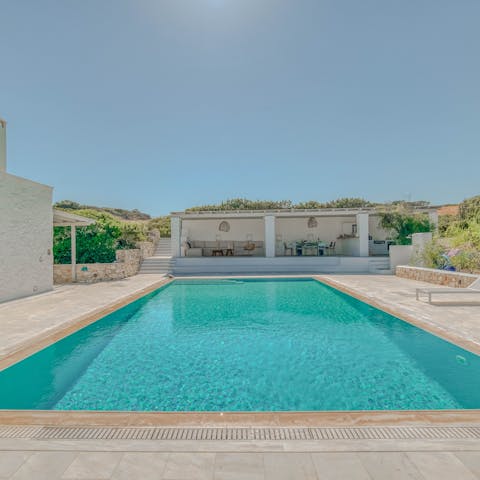 Cool down with a dip in the crystal-clear waters of this private swimming pool