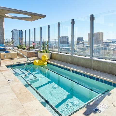 Spend chill afternoons at the communal rooftop pool, overlooking the city
