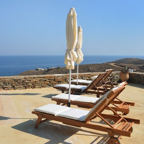 Catch some rays and get lost in a book on one of the plush sun loungers
