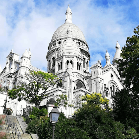 Marvel at Sacré-Cœur, a fifteen-minute stroll away