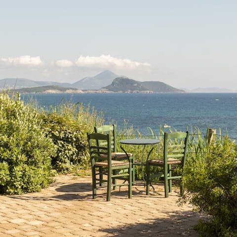 Admire the Ionian Sea views while nursing a glass of wine