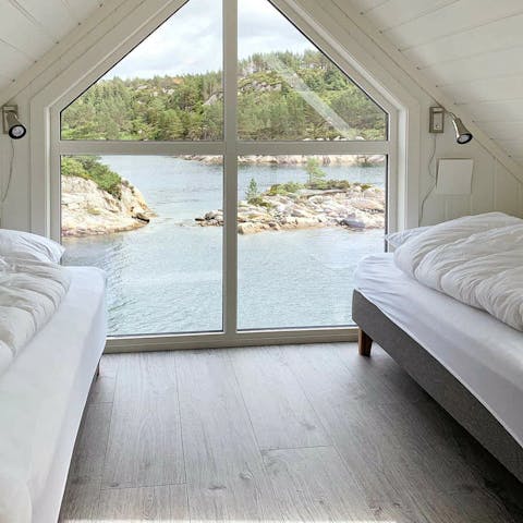 Wake up to beautiful views of sparkling water from the bedroom's large window
