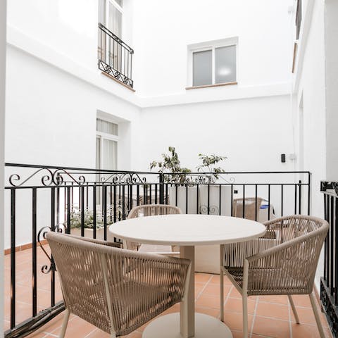Relax on your private terrace with a glass of Spanish wine