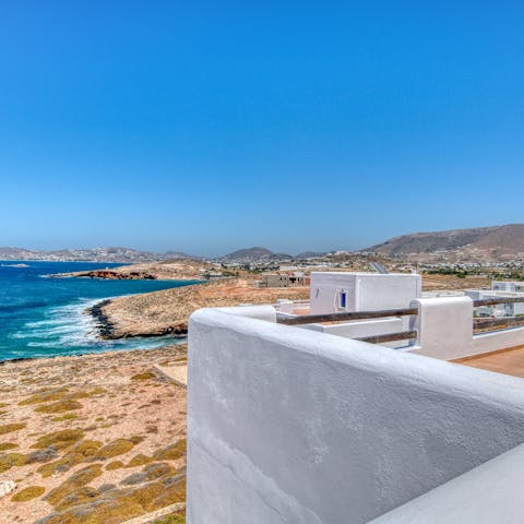Admire the stunning view of Paros' coastline from the privacy of your villa