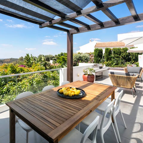 Dine alfresco on your private terrace for beautiful views of the Algarve