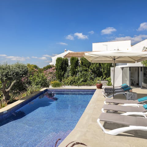 Laze on sun loungers by the pool before cooling off with a refreshing dip