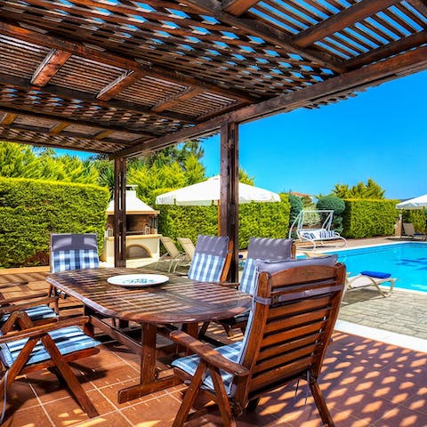 Lunch on tzatziki and pita under the pergola-shaded terrace