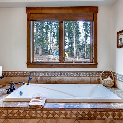 Soak in the large master bathtub