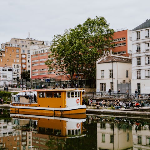 Walk just a few steps to the charming Canal Saint-Martin