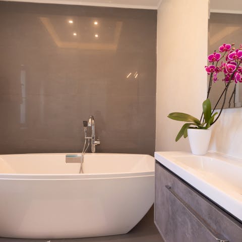 Relax after an adventure-filled day with a soak in the bathtub 