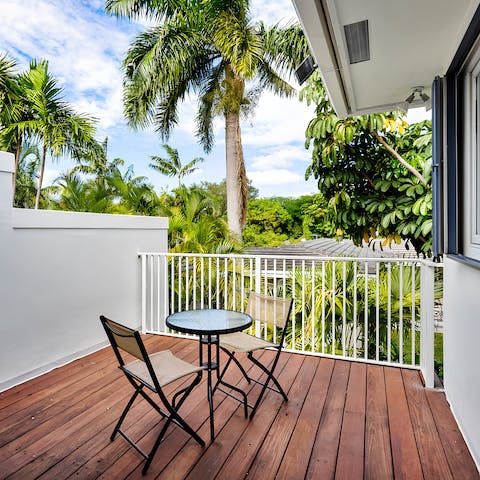Relax in peace on the secluded balcony terrace overlooking the tropical scenery