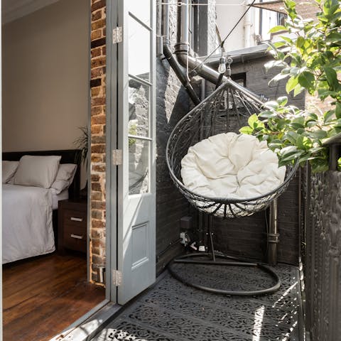 Sip a coffee in the hanging chair after rolling out of bed
