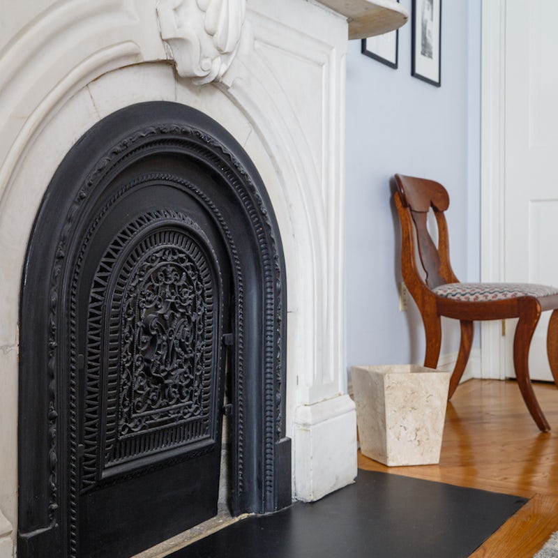 Original iron cast fire place