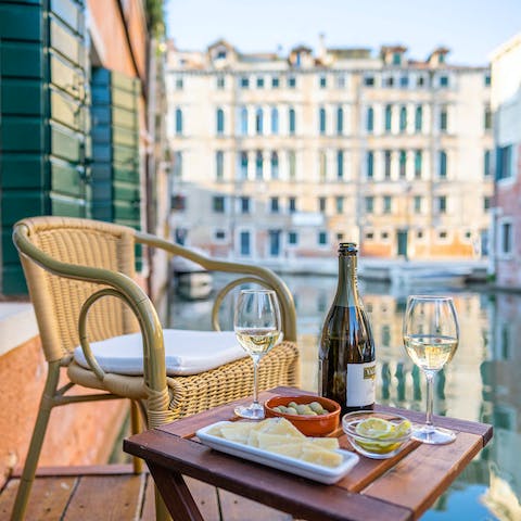 Enjoy a Venetian style aperitive on the wooden terrace