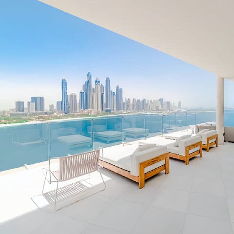 Take in spectacular Marina views from the plush terrace day beds 
