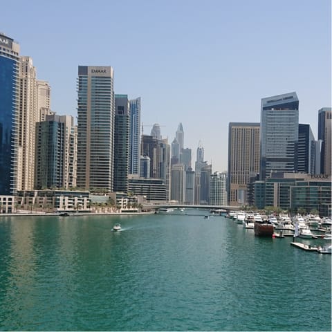 Soak up the impressive city sights from the Dubai Marina 