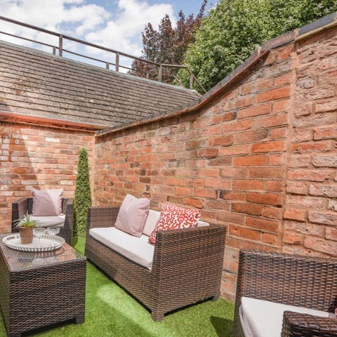 Sip your morning Earl Grey in the outdoor lounge in the back garden