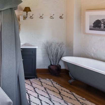 Relax and unwind in the bedroom's roll-top bath
