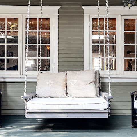 Sit back on the swing couch and move gently with the breeze