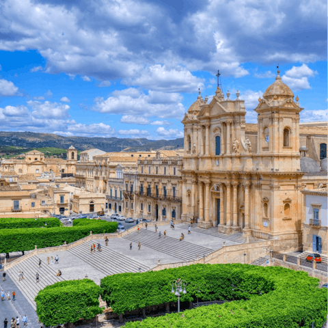 Visit Noto's beautiful 18th-century Sicilian Baroque cathedral, a fifteen-minute drive away