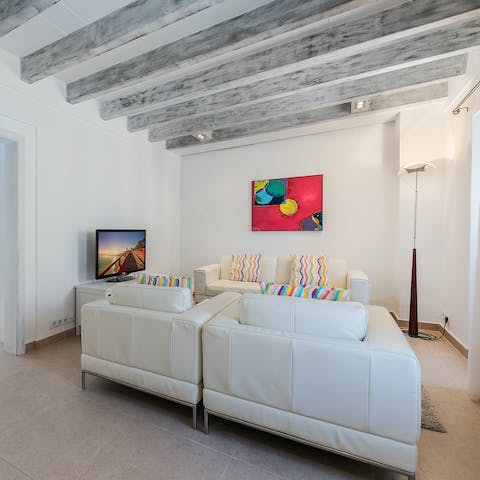 Kick back and relax in the living area with a glass of wine following a day exploring Mallorca
