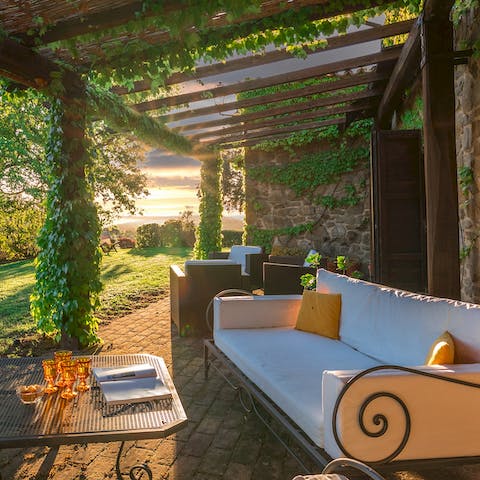 Watch the sunrise over the green hills from the outdoor lounge on the covered terrace