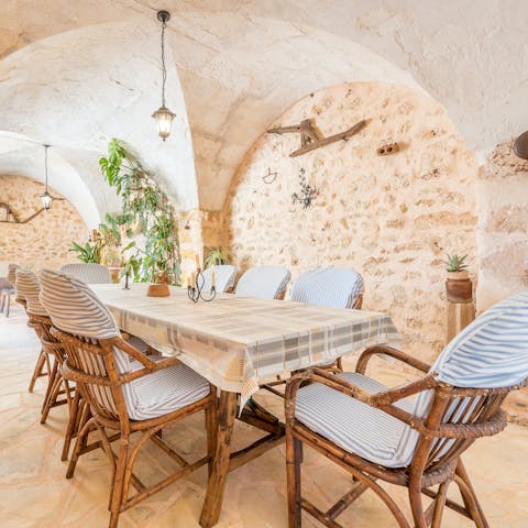 Share meals under the stone-arched dining area