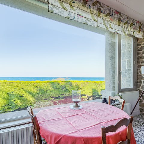 Enjoy calming coastal views from large windows and the first-floor balcony