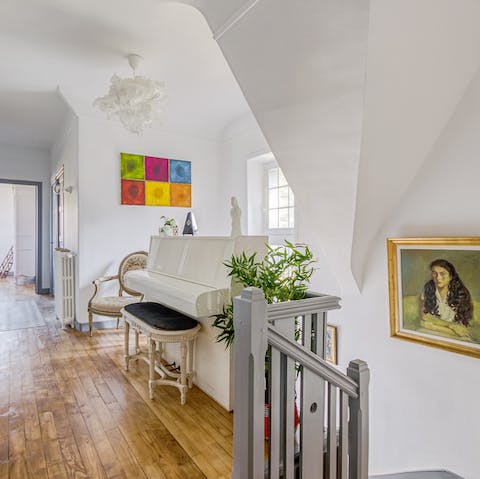 Treat guests to a sing-song around the white piano on the landing