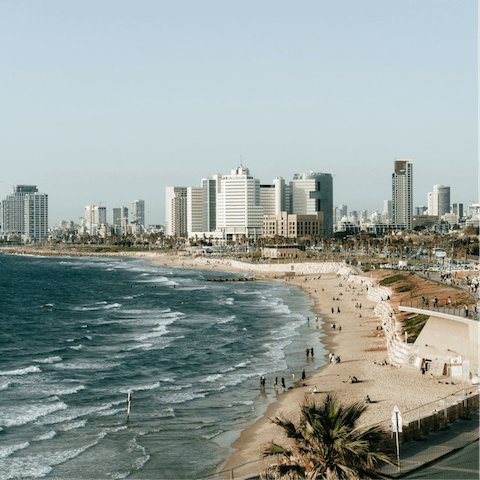Take a breezy stroll down to Aviv Beach and dip your toes into the waves
