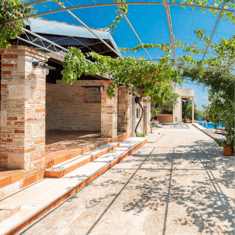 Languish on an outdoor sofa and dining area secluded away in the private courtyard