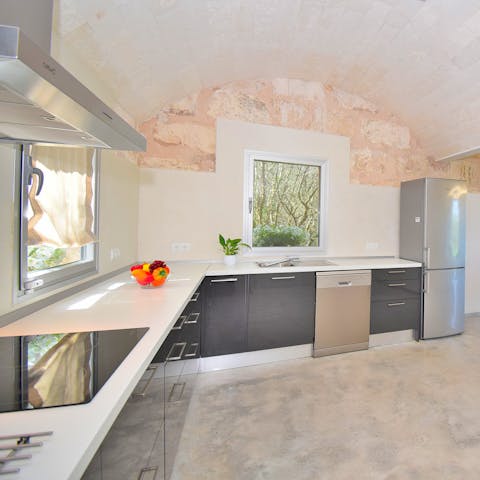 Prepare a Balearic breakfast in this sleek kitchen and gather your family to plan a trip