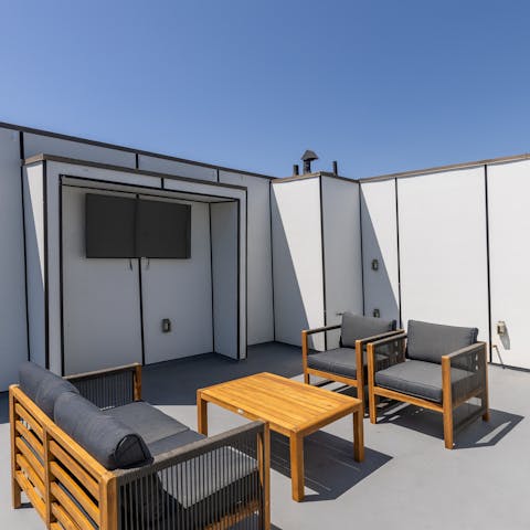 Watch a movie on your rooftop terrace while you soak in the views of the city