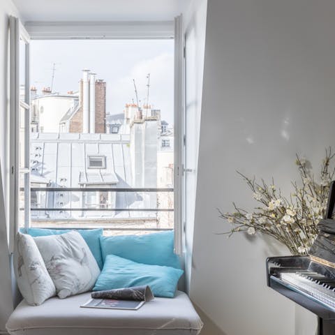 Sit down for a sing-along by the grand piano and look out across the Parisian rooftops outside
