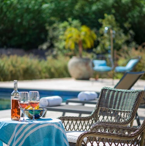 Soak up the sunshine with a drink by the pool