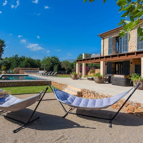 Sunbathe and read a book in one of the comfy hammocks