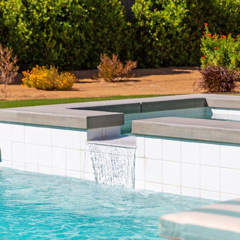 Spend your days going between the saltwater pool and the integrated waterfall spa
