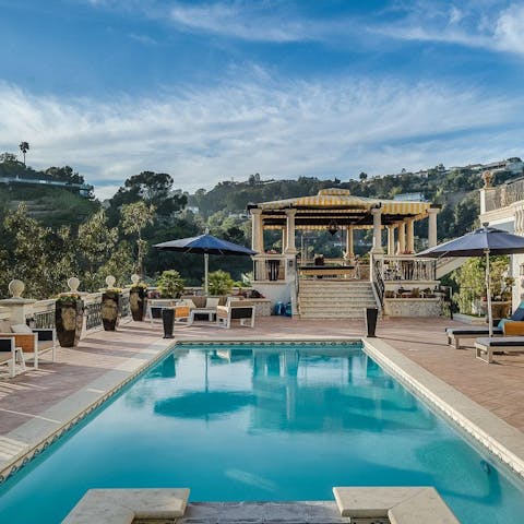 Climb out of the pool and relax under the cabana before a cookout