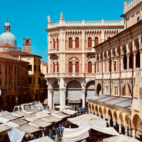 Browse the markets of Piazza delle Erbe, under a ten-minute stroll away