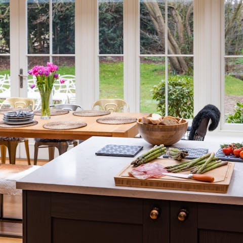 Enjoy a hearty meal in the modern kitchen underneath the vaulted skylights