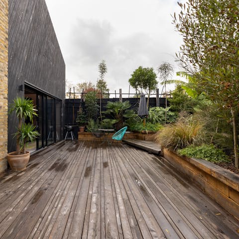 Relax in the plant-filled terrace and fire up the barbecue when guests start to get peckish