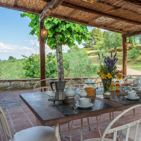 Enjoy breakfast, lunch, and dinner around the outdoor dining table with unbeatable views